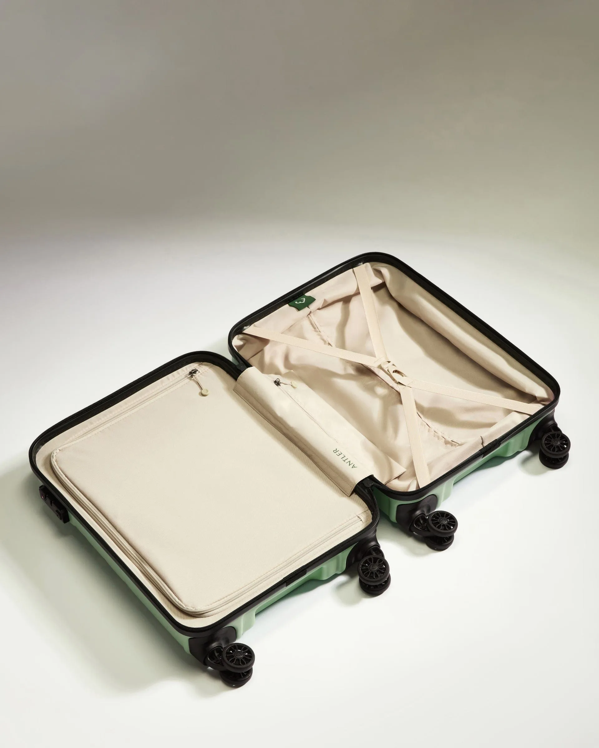 Cabin Suitcase in Aspen Green - Logo